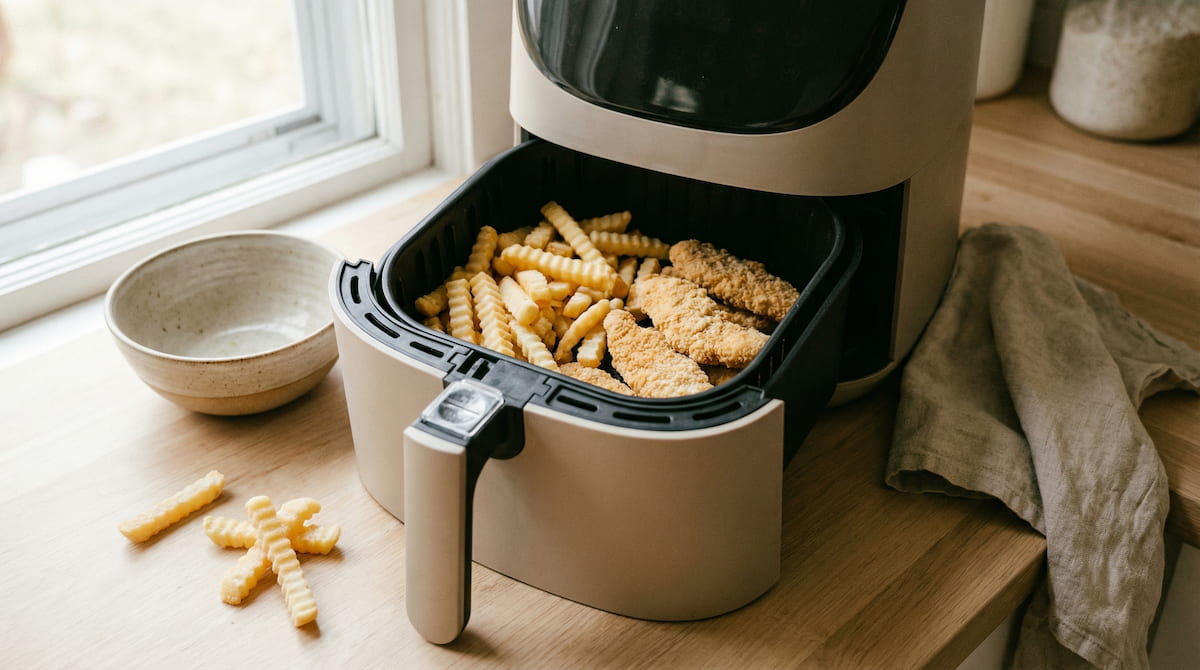 frozen food cooking safely in an air fryer basket