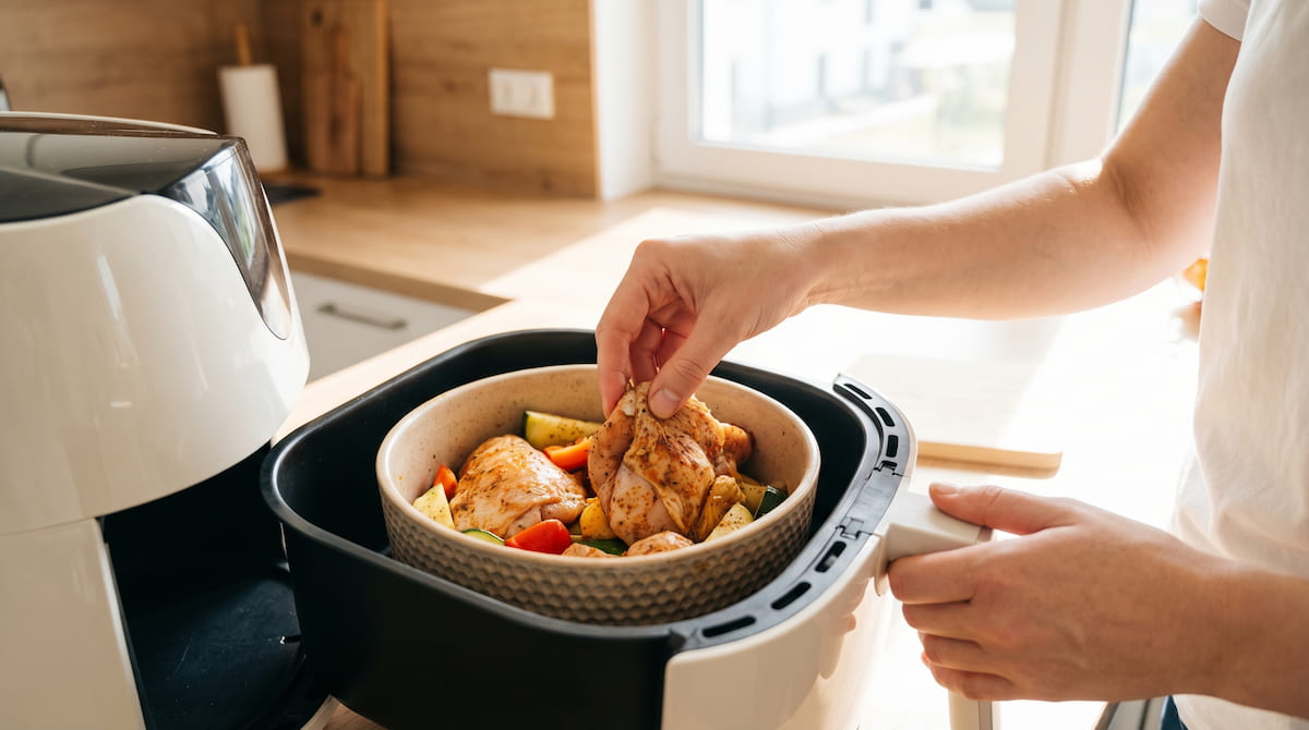 air fryer first time use placing food into ceramic basket safely