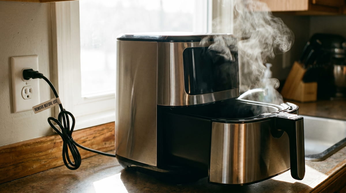 air fryer smells like plastic first use burn off vapor normal