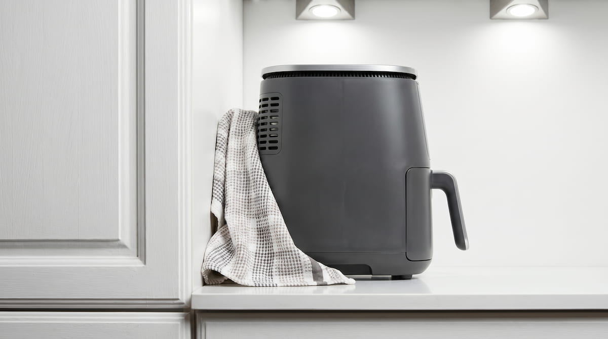 air fryer fire hazard from poor placement near cabinet and towel