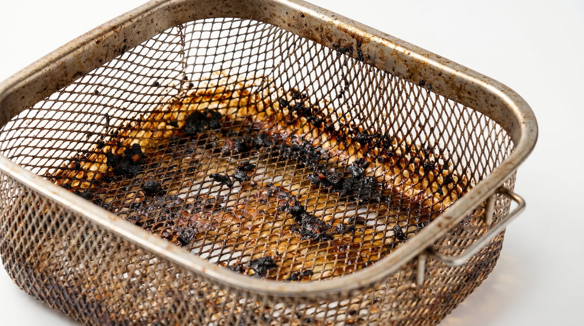 dirty air fryer basket grease buildup safety risk from not cleaning