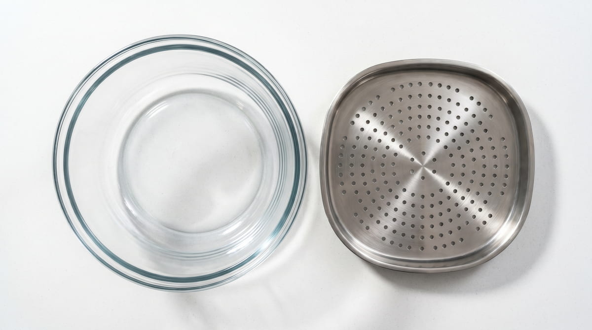 glass air fryer bowl versus stainless steel tray surface comparison flat lay