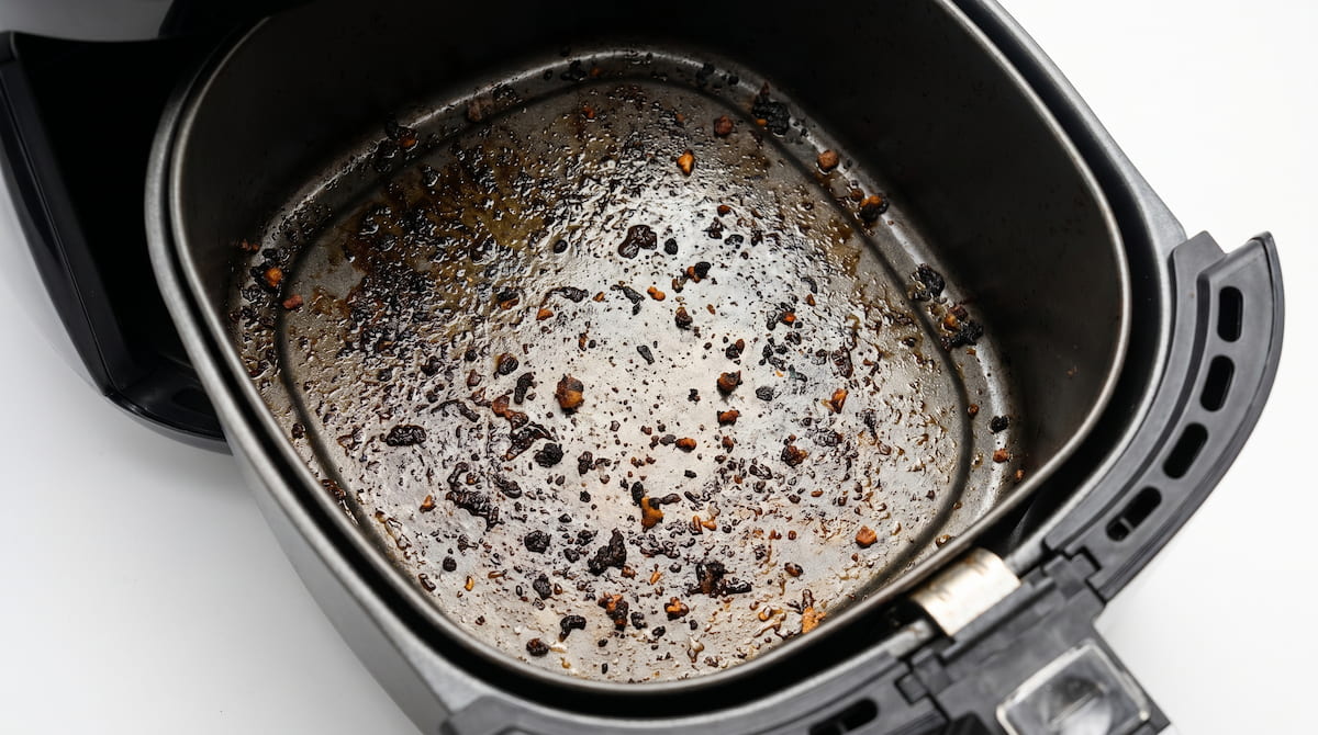 grease buildup inside air fryer causing smoke during cooking