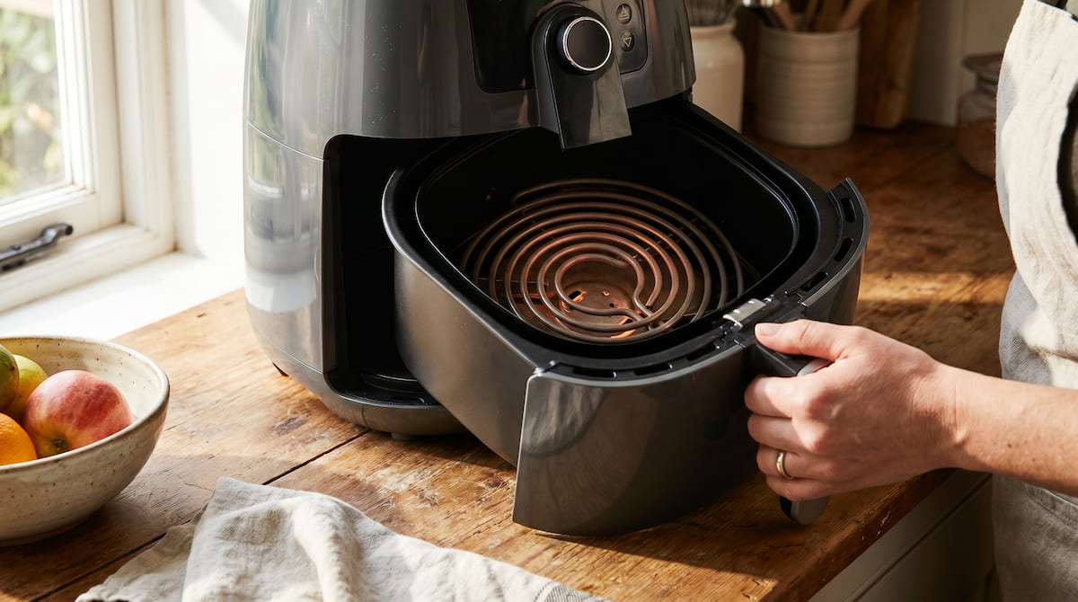 inspecting air fryer heating element coil for damage or buildup